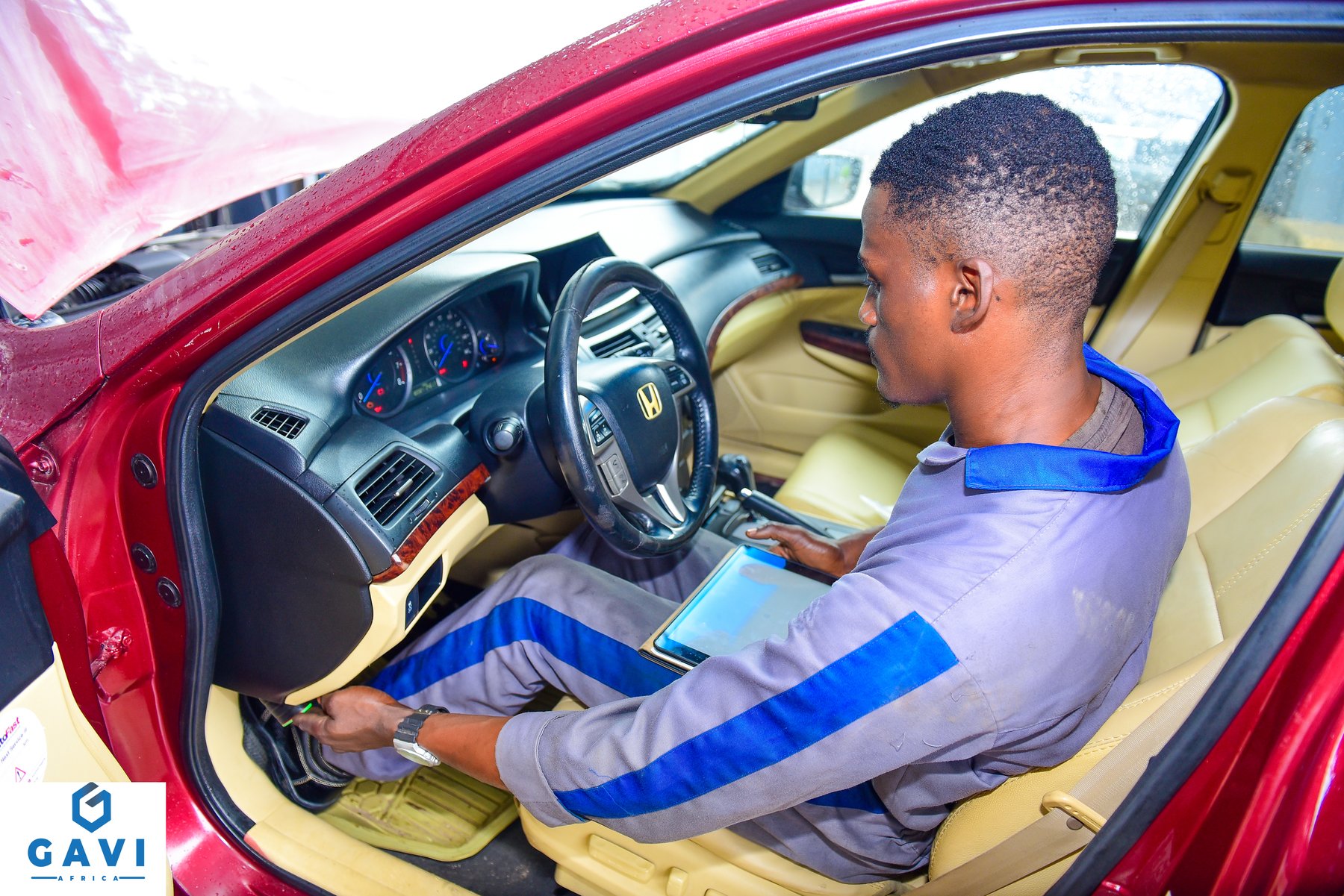 Technician running vehicle diagnostics