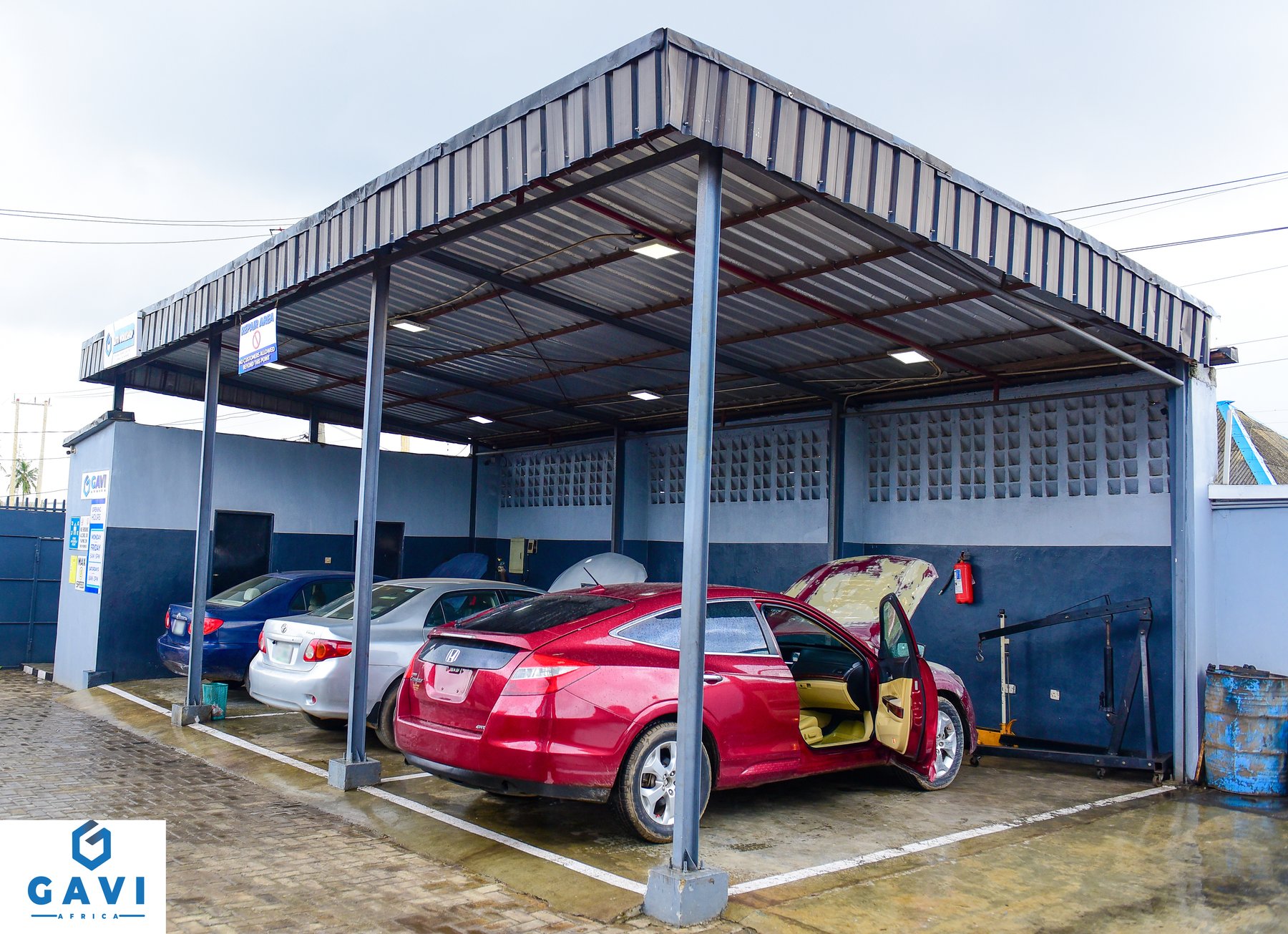 Workshop bay with vehicles in service